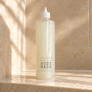 PureYou Handmade Coconut Vanilla 16 oz body wash on a shower shelf