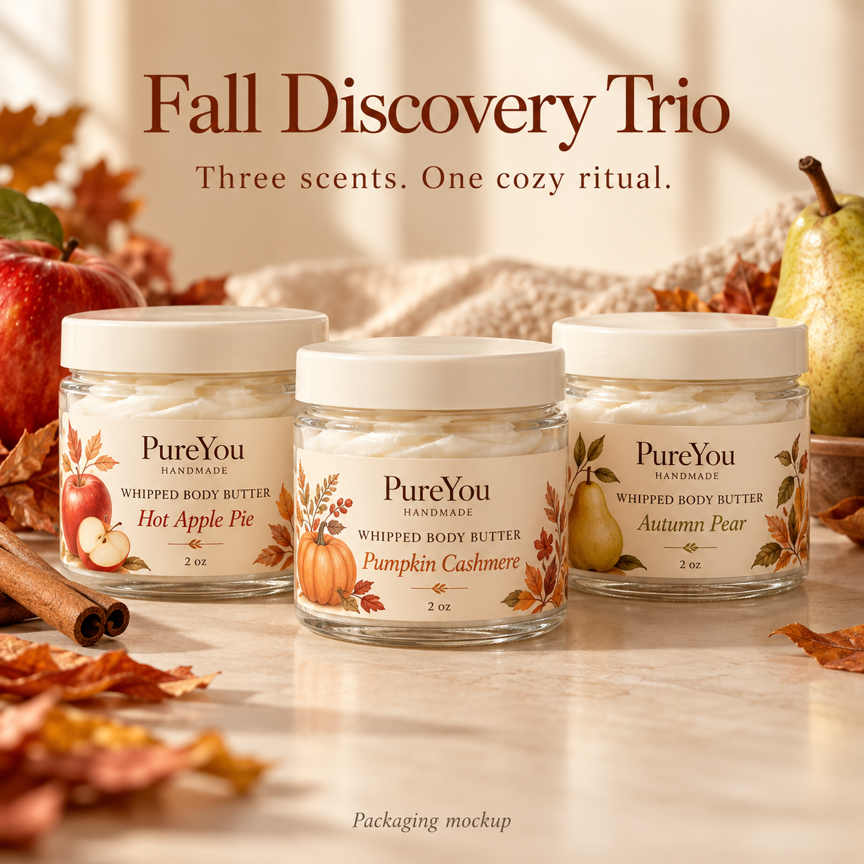 Packaging mockup of PureYou fall discovery trio: three 2 oz body butter jars in Hot Apple Pie, Pumpkin Cashmere and Autumn Pear